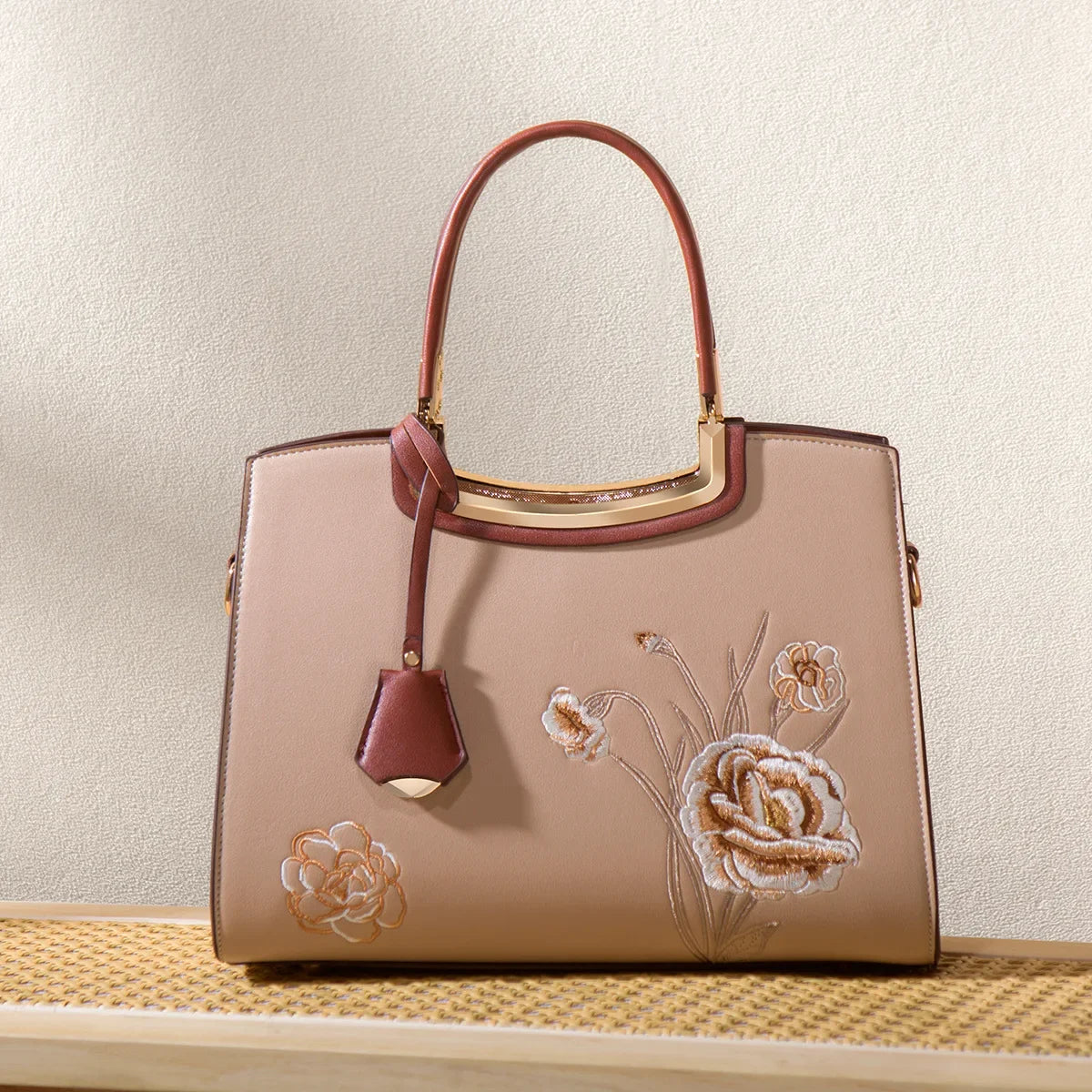 Luxury neutral handbag with embroidery