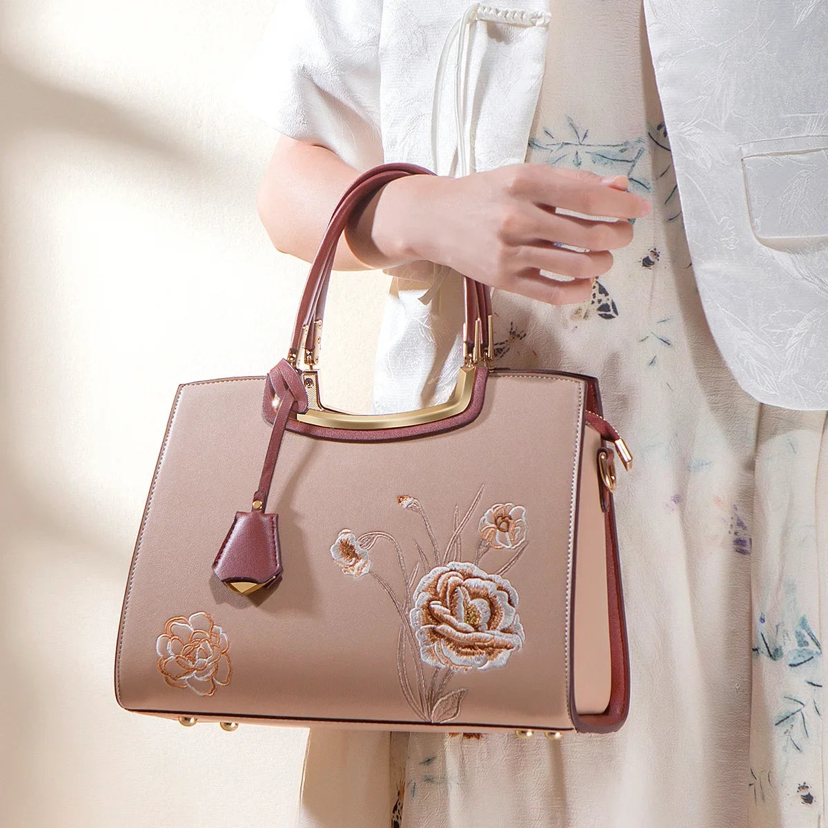 Luxury neutral handbag with embroidery