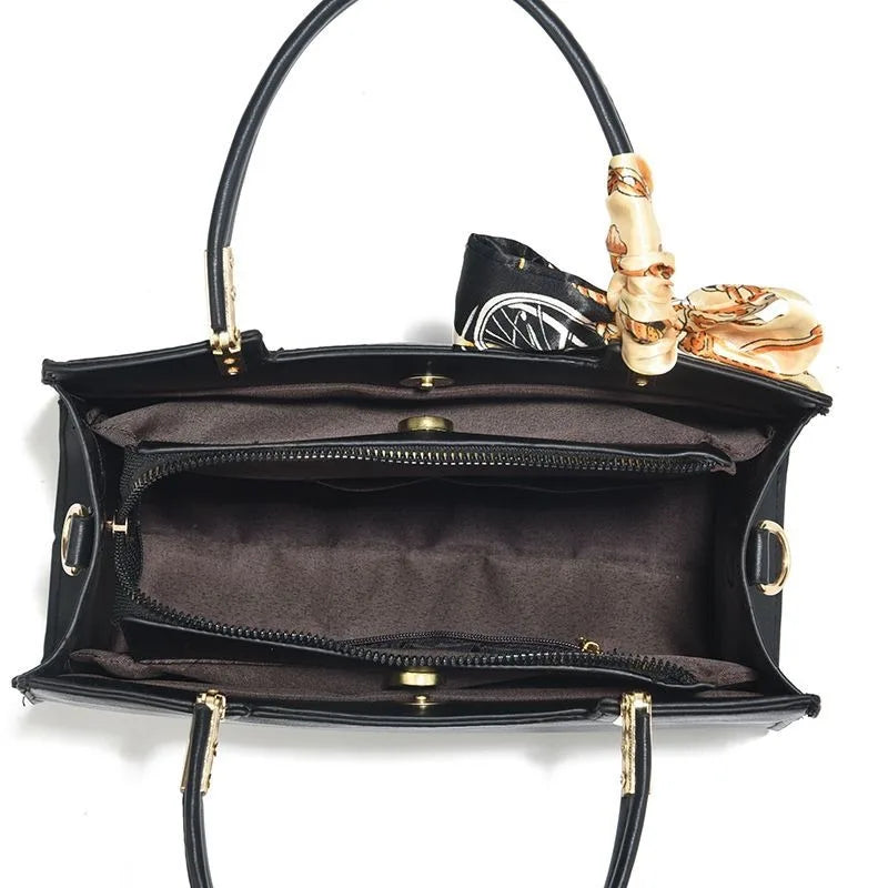 Vegan leather medium size handbag with floral embroidery